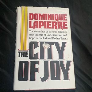 Book title : The City Of Joy. Author: Dominique Lapierre